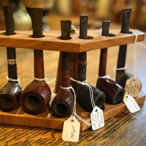 assorted pipes and pipe stand