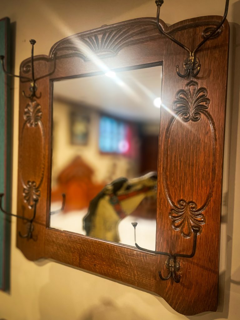 Antique Oak Mirror with Hooks. 385.00 CND