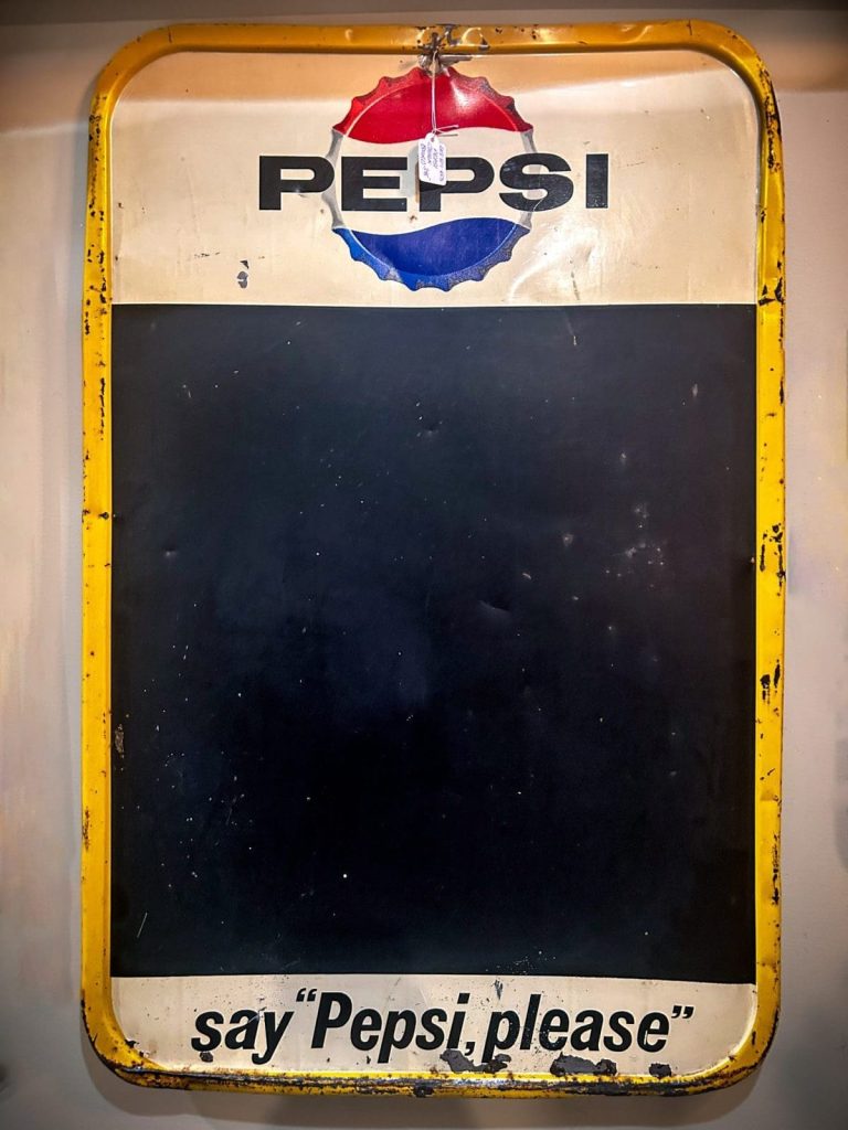 Authentic 1960s Pepsi chalkboard sign with iconic branding and retro charm. Ideal for collectors or as a functional vintage decor piece.